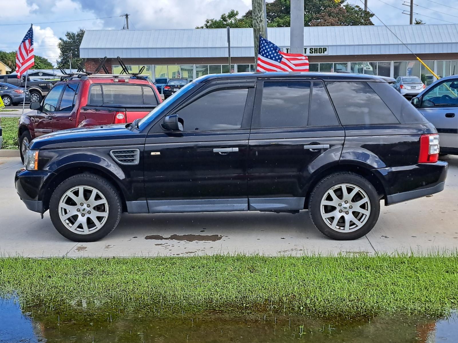 2009 Black Land Rover Range Rover Sport HSE (SALSK25489A) with an 4.4L V8 DOHC 32V engine, 6-Speed Automatic Overdrive transmission, located at 1181 Aurora Rd, Melbourne, FL, 32935, (321) 241-1100, 28.132914, -80.639175 - Photo #0
