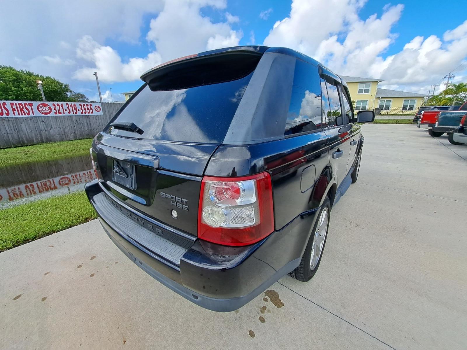 2009 Black Land Rover Range Rover Sport HSE (SALSK25489A) with an 4.4L V8 DOHC 32V engine, 6-Speed Automatic Overdrive transmission, located at 1181 Aurora Rd, Melbourne, FL, 32935, (321) 241-1100, 28.132914, -80.639175 - Photo #2