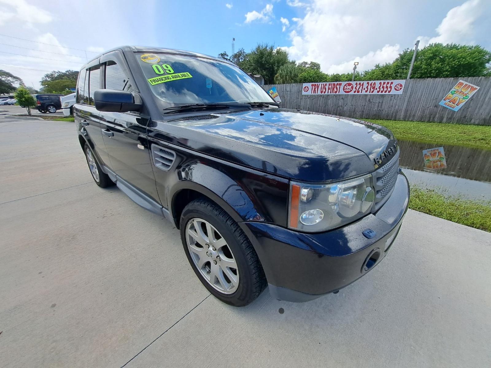 2009 Black Land Rover Range Rover Sport HSE (SALSK25489A) with an 4.4L V8 DOHC 32V engine, 6-Speed Automatic Overdrive transmission, located at 1181 Aurora Rd, Melbourne, FL, 32935, (321) 241-1100, 28.132914, -80.639175 - Photo #1